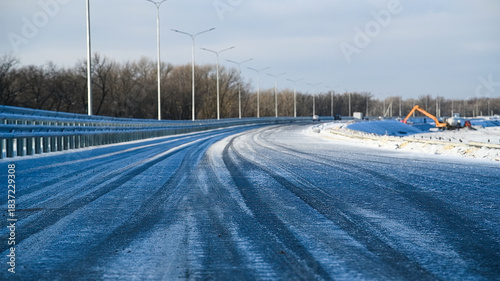 Winter highway. Driving along the motorway on a sunny, frosty winter day.