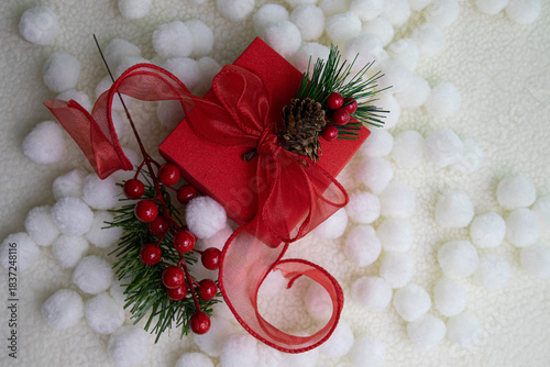 a beautifully wrapped Christmas gift, featuring festive decorations.