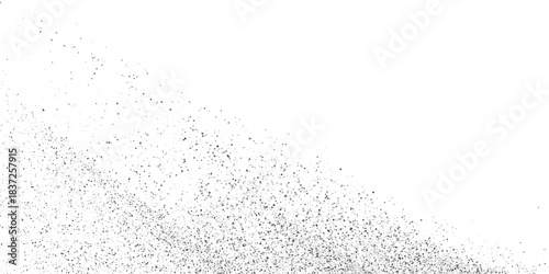 Scattered white particles and dots of varying sizes against a solid black background creating a dynamic abstract effect