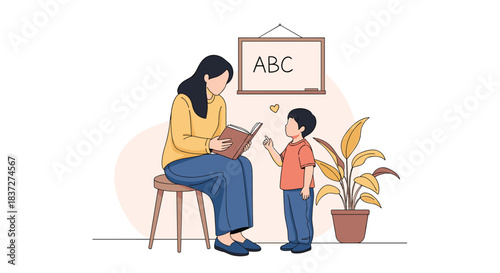 Female teacher or mother reads a storybook to an attentive young boy helping him learn the alphabet in a classroom setting.