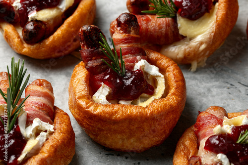Stuffed Yorkshire Puddings with pig in blankets, camembert cheese and cranberry sauce