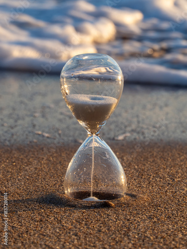 Hourglass on the sand of Tavernes de Valldigna beach (Valencia-Spain)