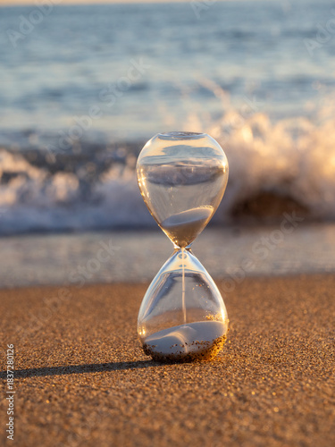 Hourglass on the sand of Tavernes de Valldigna beach (Valencia-Spain)