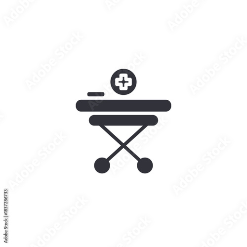 A medical stretcher icon representing emergency support, hospital patient transport, and essential clinical care equipment.