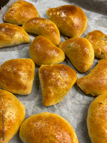 Preparation of a little tasty traditional latvian bacon patty from a yeast dough with a meat or bacon filling