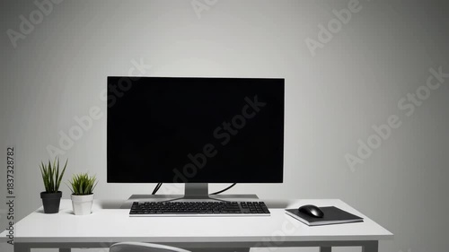 Minimalist home workstation with a single monitor, clean desk layout, and soft natural daylight creating a calm, organized, and visually simple remote-work environment.