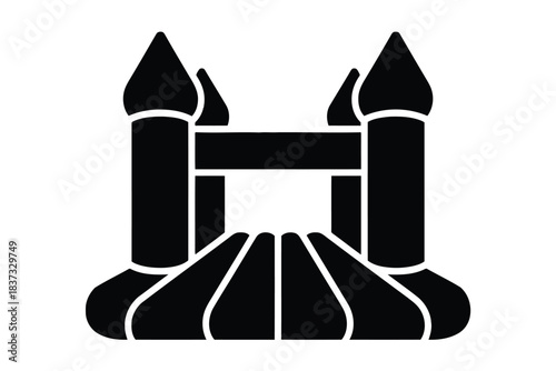 Black silhouette icon of a bouncy castle with pointed towers and arched entrance Keywords: bouncy castle, resilient architecture silhouette
