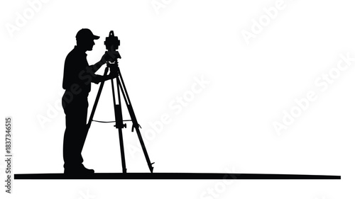 Silhouette of a surveyor using a theodolite on a tripod against white