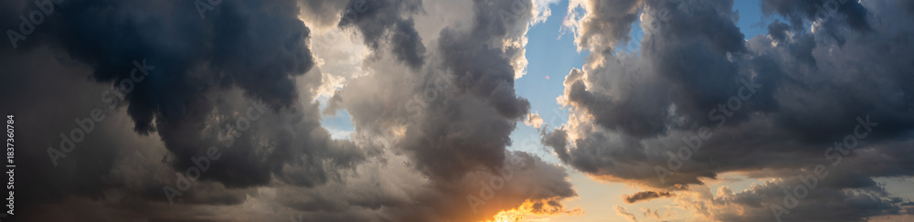 Fototapeta premium Panoramic seascape with dramatic stormy sky and sun rays