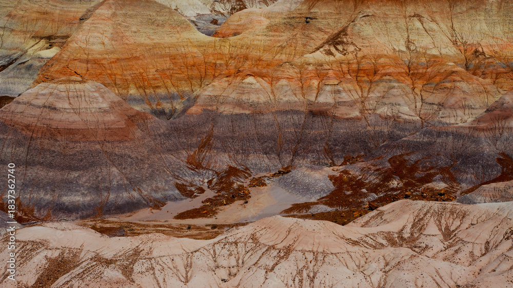 Naklejka premium Landscape of rock strata with foreground of white hills, South Dakota