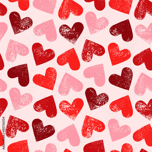 Linocut hearts seamless repeat vector pattern. Hand printed grunge relief printing textured aged distressed heart shapes endless Valentine's day background. Craft handmade wrapping paper template