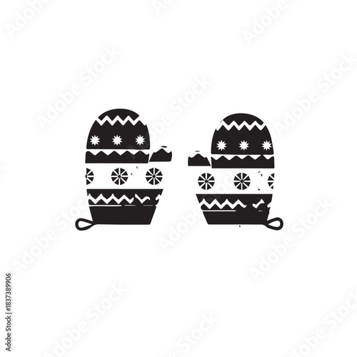 Pair of knitted mittens with geometric patterns for winter warmth and style.