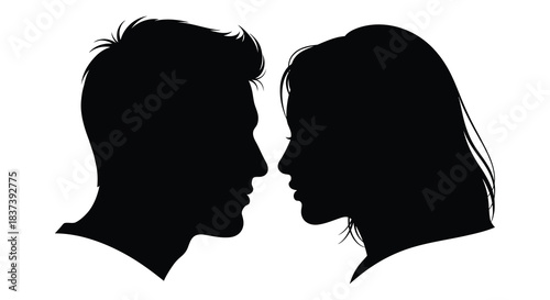 A couple facing each other in a dark dramatic silhouette