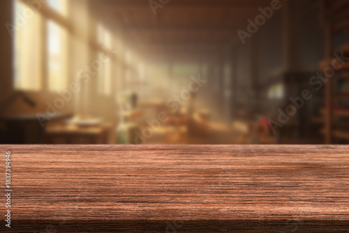 A beautiful warm light fills the interior of a workshop or studio, with a wooden countertop in the foreground.