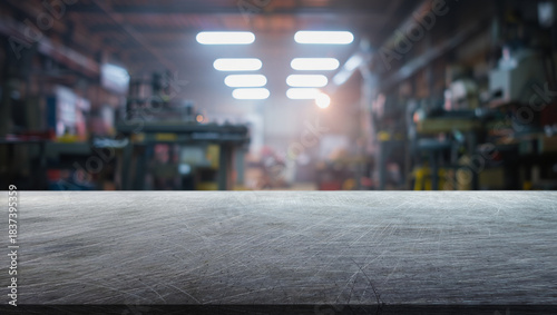 Scratched steel table top and background of a factory with cold light