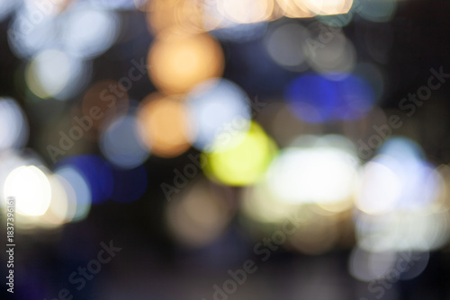 Quadro em tela Bokeh effect shows colorful lights in a busy city street at night with blurred s