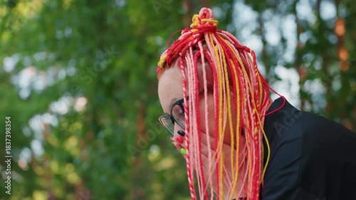 profile view of surprised lady in nature, woman with braided hair exhibits shock in leafy setting, observant passerby notices white woman with expressive features and vibrant hair in lush park