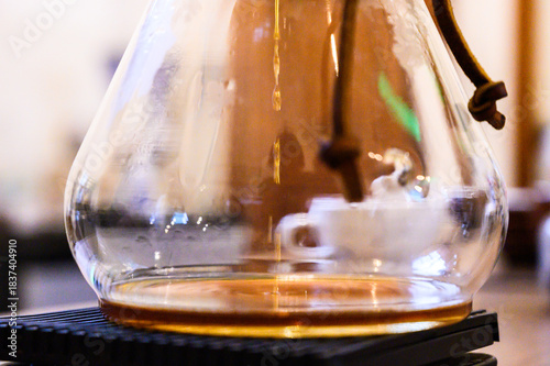 Chemex pour over coffee brewing in glass carafe