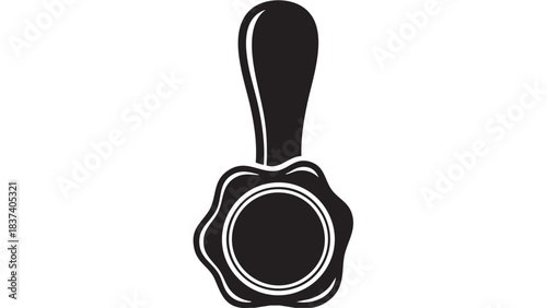 A black wax seal stamp on a white background viewed from directly above