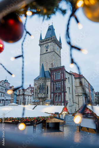 Christmas market at Old Town Square in Prague with the Church of Our Lady before Týn, decorated Christmas tree, festive lights, historic architecture, and magical winter holiday atmosphere.