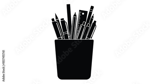 A collection of various black writing and drawing tools in a dark container