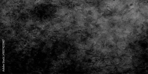 Dark grunge texture background featuring an old, distressed black and white vintage wall surface