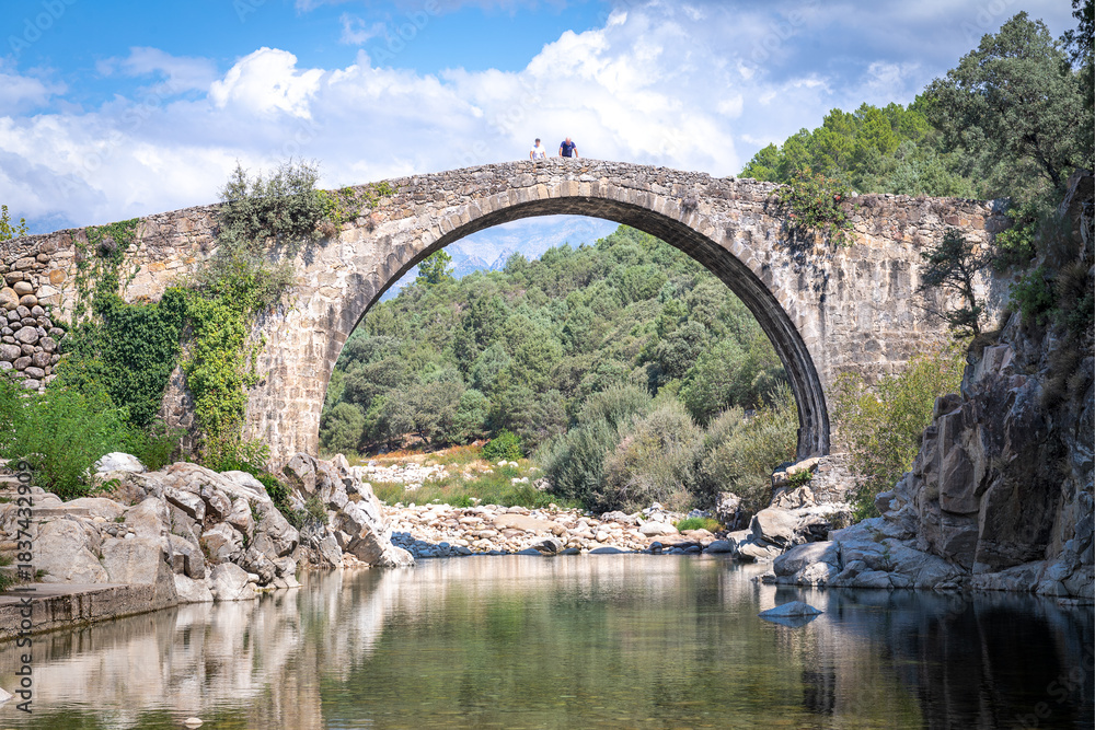 Fototapeta premium Imposing, high, historic, monumental Roman stone bridge structure.