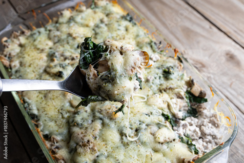Healthy low-carb turkey, spinach, and mushroom bake in a casserole dish. Fresh, high-protein meal prep recipe with baked vegetables.