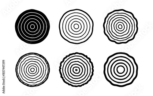 Set of hand-drawn circular tree rings in minimalist black and white style