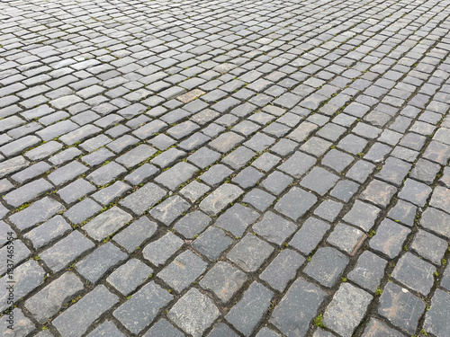 Abstract background. Old cobblestone pavement closeup