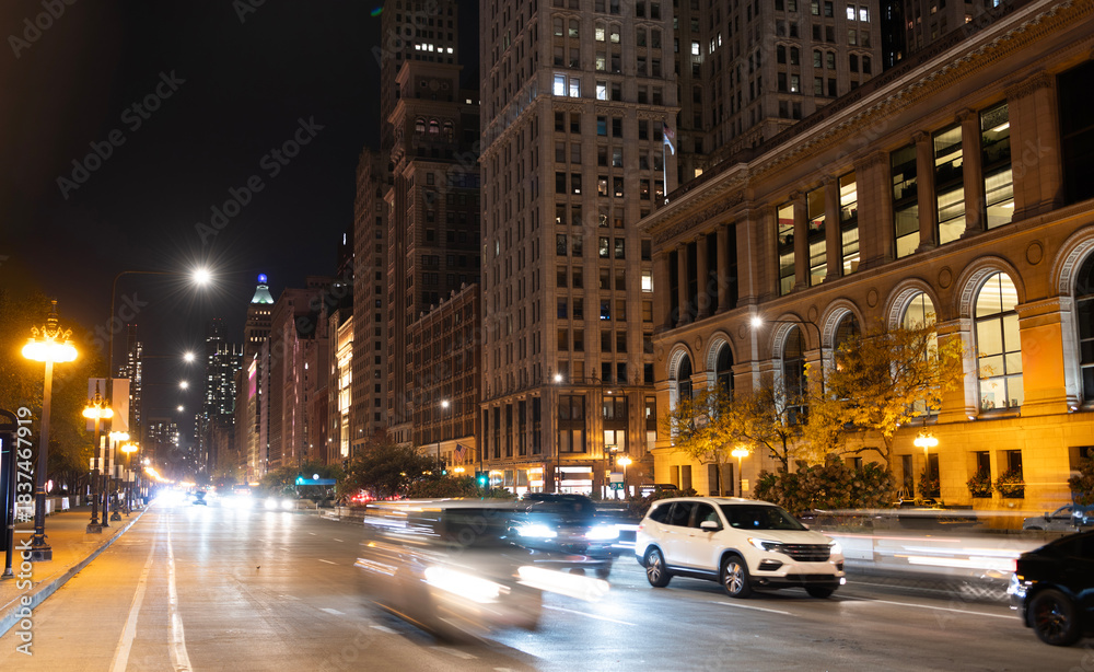 Naklejka premium City night illuminated building. Skyscraper cityscape. Night city of Chicago. Business city. Night cityscape of Chicago skyscraper building. Chicago architecture of skyscraper. Midnight downtown