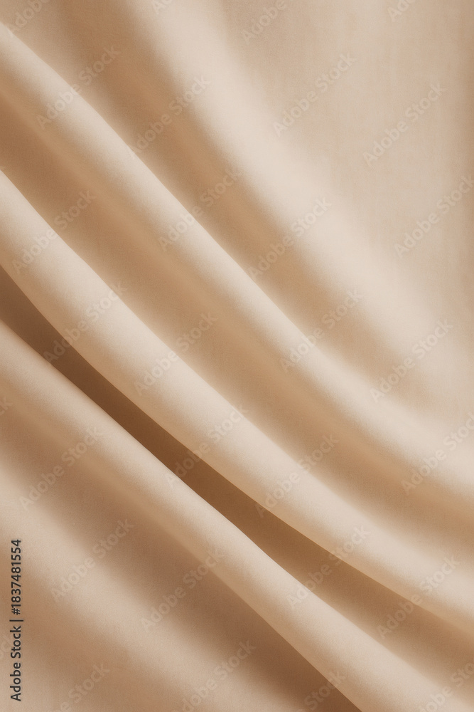 Fototapeta premium Smooth, light beige fabric with flowing, gentle folds. The soft, neutral tone creates a calming and elegant texture ideal for various designs.