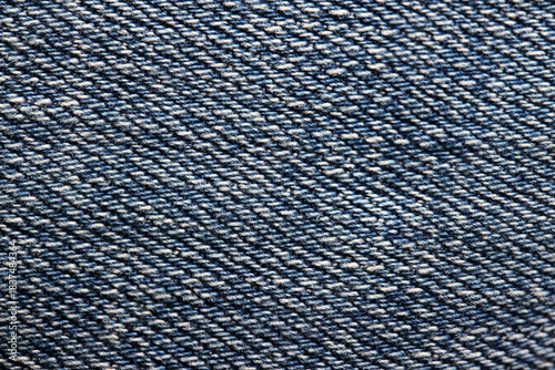 Blue denim fabric texture close-up. Abstract textile background.