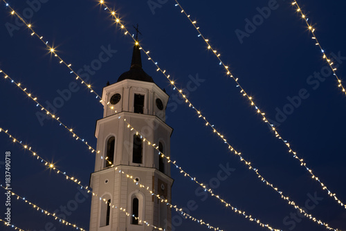 Vilnius Cathedral Bell Tower Framed by Sparkling Christmas Lights at Night