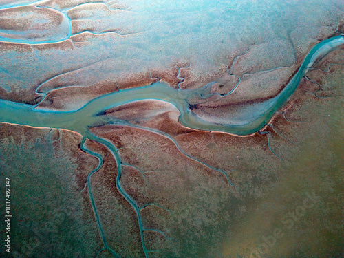 Aerial view of the tidal mudflats and channels of the Eemsdelta, Groningen, The Netherlands