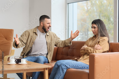 Young man screaming at his ...