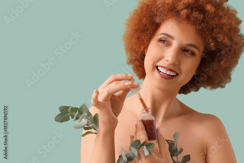 Smiling woman with curly re...