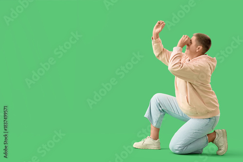 Young woman looking through...