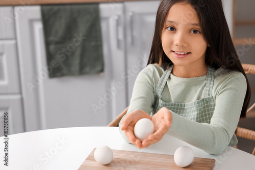 Cute Asian girl with boiled...