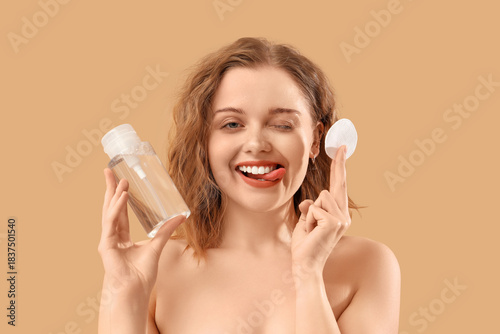 Young woman with bottle of ...