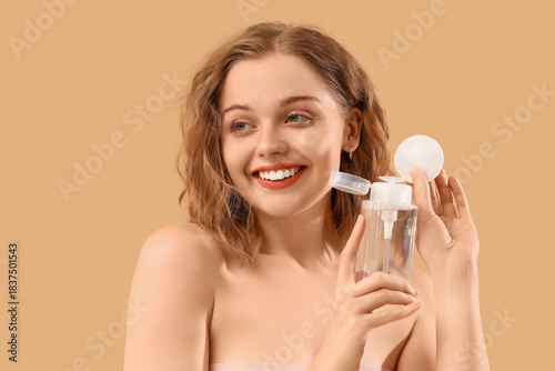 Young woman with bottle of ...