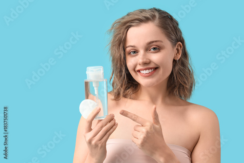 Young woman with bottle of ...