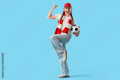 Female soccer fan with ball...