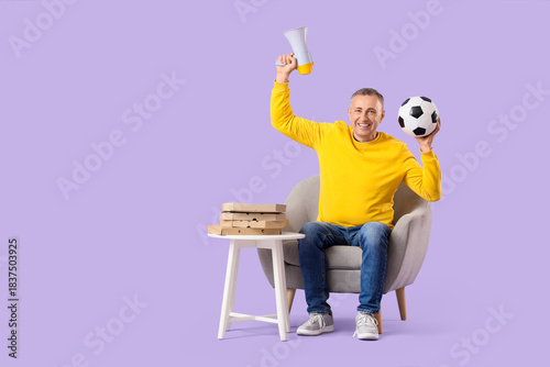 Male sports fan with soccer...