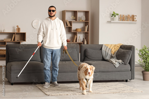 Blind young man with stick ...
