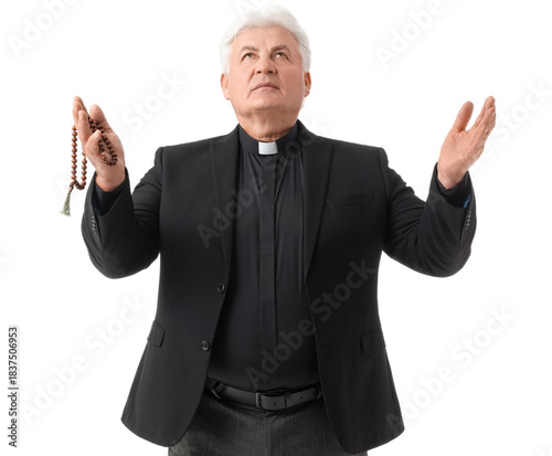 Senior priest praying with ...