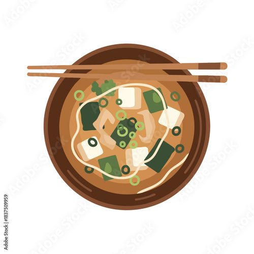 Top view of steaming hot noodle soup with tofu and vegetables