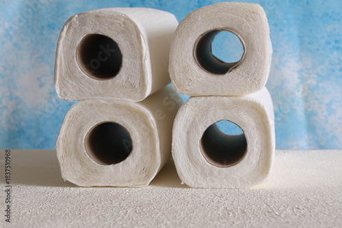 Close-Up of Rolled Paper Towels on a Blue Background