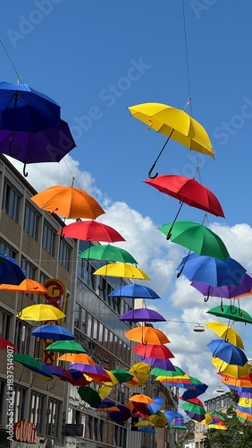 beautiyfull decoration of colorfull umbrellas hang on the street. High quality vertical photo