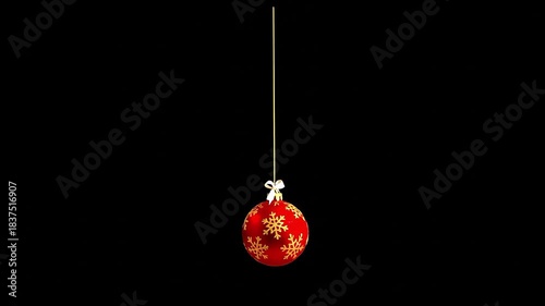Animated red Christmas ornament with snowflake pattern hanging on a string on a black background. Perfect for Christmas, New Year, etc.